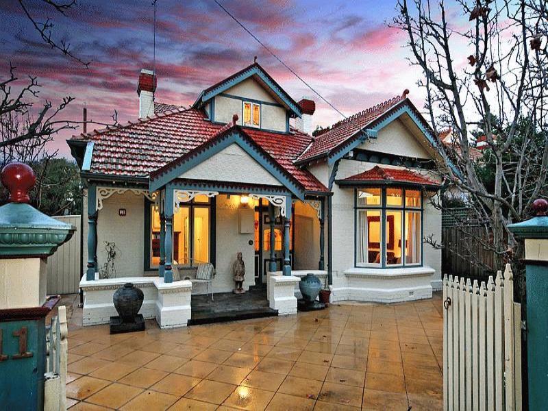 Brick californian bungalow house exterior with bay windows & window