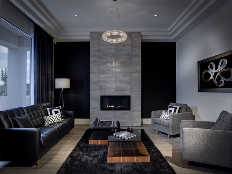 Open plan living room using grey colours with stone & fireplace ...